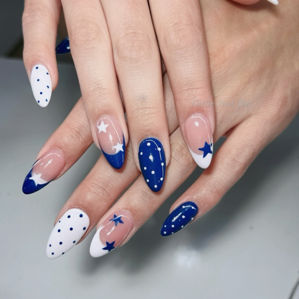 navy blue star nail art on long almond gel x